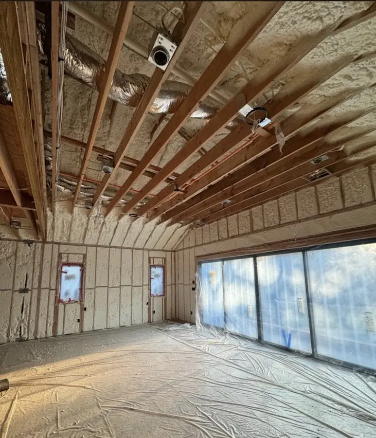 Interior walls and ceiling insulated with spray foam during new construction in North Strabane